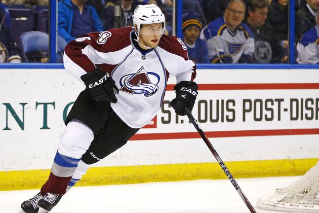 Colorado Avalanche's Erik Johnson skates with the puck during the first period of an NHL hockey game against the St. Louis Blues, Monday, Jan. 19, 2015, in St. Louis. The Blues won the game 3-1. (AP Photo/Billy Hurst)