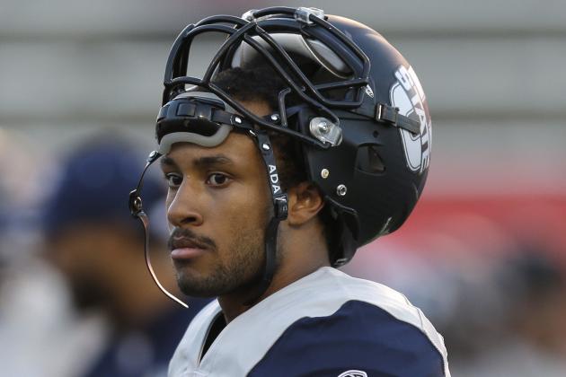 Utah State quarterback Chuckie Keeton (16) looks on during practice before the start of their NCAA college football game against Utah Friday, Sept. 11, 2015, in Salt Lake City. (AP Photo/Rick Bowmer)