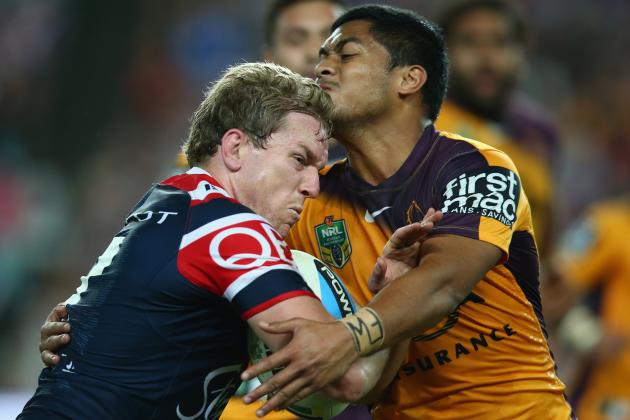 SYDNEY, AUSTRALIA - AUGUST 22:  Mitchell Aubusson of the Roosters is tackled during the round 24 NRL match between the Sydney Roosters and the Brisbane Broncos at Allianz Stadium on August 22, 2015 in Sydney, Australia.  (Photo by Mark Kolbe/Getty Images)