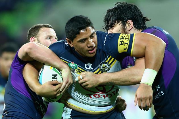 MELBOURNE, AUSTRALIA - AUGUST 29:  Jason Taumalolo of the Cowboys is tackled during the round 25 NRL match between the Melbourne Storm and the North Queensland Cowboys at AAMI Park on August 29, 2015 in Melbourne, Australia.  (Photo by Robert Prezioso/Getty Images)
