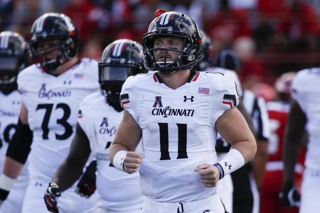 Cincinnati quarterback Gunner Kiel (11) runs back to the sideline in the first half of an NCAA college football game against Miami of Ohio at Yager Stadium, Saturday, Sept. 19, 2015, in Oxford, Ohio. Cincinnati won 37-33. (AP Photo/John Minchillo)