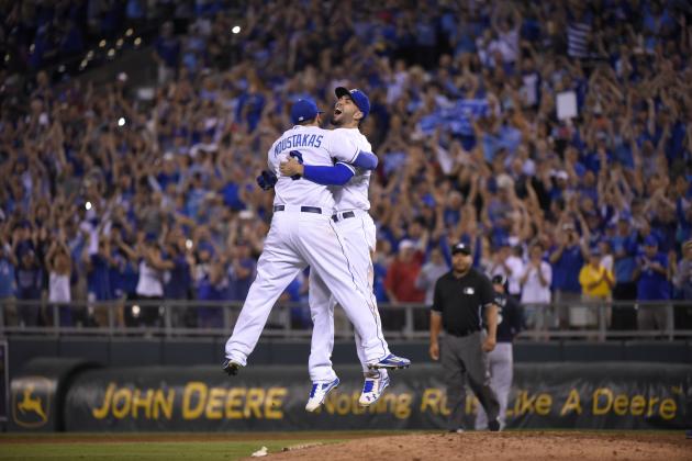 KANSAS CITY, MO - SEPTEMBER 24:  Mike Moustakas #8 and Eric Hosmer #35 of the Kansas City Royals embrace as they cerebrate after thaking the American League Central Division title at Kauffman Stadium on September 24, 2015 in Kansas City, Missouri. The Royals beat the Seattle Mariners 10-4.  (Photo by Ed Zurga/Getty Images)