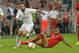 Munichs Douglas Costa, right, fights for the ball with Madrid's Daniel Carvajal during their friendly soccer match between FC Bayern and Real Madrid in the Allianz Arena stadium in Munich, southern Germany, Wednesday, Aug. 5, 2015. (AP Photo/Kerstin Joensson)