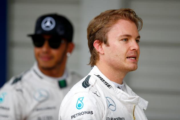 SUZUKA, JAPAN - SEPTEMBER 26:  Nico Rosberg of Germany and Mercedes GP looks on next to Lewis Hamilton of Great Britain and Mercedes GP in Parc Ferme after claiming pole position during qualifying for the Formula One Grand Prix of Japan at Suzuka Circuit on September 26, 2015 in Suzuka.  (Photo by Clive Rose/Getty Images)