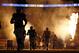 Members of the St. Louis Rams run on the field before an NFL football game against the Pittsburgh Steelers, Sunday, Sept. 27, 2015, in St. Louis. The game was delayed because part of the pyrotechnics used during the introductions briefly caught the turf on fire. (AP Photo/Billy Hurst)