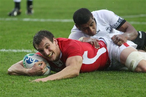 Wales' Sam Warburton scores a try during their Rugby World Cup game against Fiji at Waikato Stadium in Hamilton, New Zealand, Sunday, Oct. 2, 2011.  (AP Photo/Dita Alangkara)