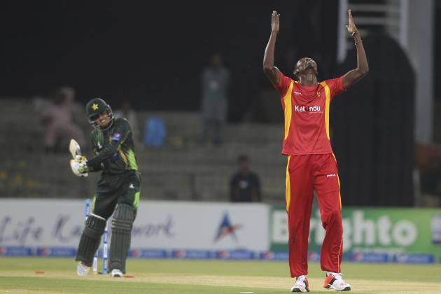 Zimbabwe pacer Christopher Mpofu, right, celebrates after taking wicket of Pakistan's Baber Azam, left, during third one-day international match between Pakistan and Zimbabwe at Gaddafi Stadium in Lahore, Pakistan, Sunday, May 31, 2015. (AP Photo/Anjum Naveed)