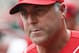 Cincinnati Reds manager Bryan Price walks through the dugout in the sixth inning of a baseball game against the Pittsburgh Pirates, Monday, Sept. 7, 2015, in Cincinnati. (AP Photo/John Minchillo)