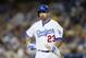 Los Angeles Dodgers first baseman Adrian Gonzalez walks back to the dugout after striking out against the Colorado Rockies during the first inning of a baseball game, Monday, Sept. 14, 2015, in Los Angeles. (AP Photo/Danny Moloshok)
