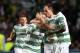 Celtic's Kris Commons, left, celebrates his goal with his teammates during their Champions League qualifying play-off second leg soccer match against Shakhter Karagandy at Celtic Park, Glasgow, Scotland, Wednesday Aug. 28, 2013. (AP Photo/Scott Heppell)