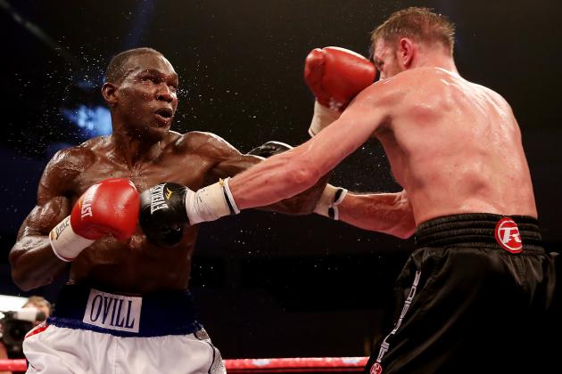 CARDIFF, WALES - AUGUST 17:  Enzo Maccarinelli (R) in action with Ovill McKenzie during their Commonwealth Light-Heavyweight Championship bout at Motorpoint Arena on August 17, 2013 in Cardiff, Wales.  (Photo by Scott Heavey/Getty Images)