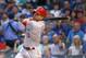 Cincinnati Reds' Joey Votto hits a home run off Chicago Cubs starting pitcher Dan Haren during the first inning of a baseball game Tuesday, Sept. 1, 2015, in Chicago. (AP Photo/Charles Rex Arbogast)