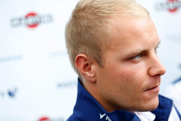 SPA, BELGIUM - AUGUST 20:  Valtteri Bottas of Finland and Williams speaks with members of the media in the paddock during previews to the Formula One Grand Prix of Belgium at Circuit de Spa-Francorchamps on August 20, 2015 in Spa, Belgium.  (Photo by Charles Coates/Getty Images)