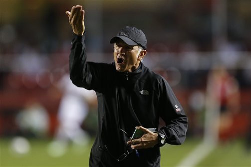 Coach Juan Carlos Osorio of Colombia’s Atletico Nacional gives instructions to his players during a Copa Sudamericana semi-final soccer match against Brazil's Sao Paulo F.C. in Sao Paulo, Brazil, Wednesday, Nov. 26, 2014. (AP Photo/Andre Penner)