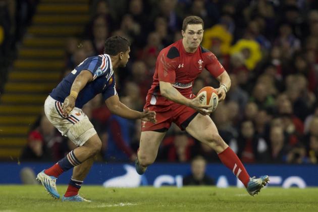 Wales' George North, right, keeps the ball from France's Wesley Fofana during their Six Nations rugby union international match at the Millennium Stadium, Cardiff, Wales, Friday, Feb. 21, 2014. (AP Photo/Jon Super)