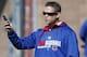 FILE - In this Feb. 25, 2015, file photo, Chicago Cubs president of baseball operations Theo Epstein talks on his phone during a spring training baseball practice in Mesa, Ariz. Epstein's answer to the question that's haunted Cubs fans for a century-and-counting hasn't changed. It's the same one he gave four years ago, when Epstein was introduced as the franchise's latest savior to great fanfare and pleaded for patience: He has no idea. Neither does anyone else.(AP Photo/Matt York, File)