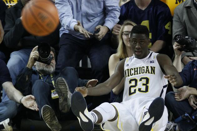 ANN ARBOR, MI - DECEMBER 30:  Caris LeVert #23 of the Michigan Wolverines lands out of bounds after keeping the ball in bounds during the second half of a game against the Illinois Fighting Illini at Crisler Arena on December 30, 2014 in Ann Arbor, Michigan. Michigan defeated Illinois in overtime 73-65. (Photo by Duane Burleson/Getty Images)