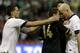 Mexico's Javier Hernandez, center, is held by United States captain Clint Dempsey, left, as he confronts United States' Michael Bradley at the end of a 2014 World Cup qualifying match at the Aztec stadium in Mexico City, Tuesday, March 26, 2013. The match ended 0-0. (AP Photo/Eduardo Verdugo)