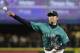 Seattle Mariners starting pitcher Hisashi Iwakuma throws against the Colorado Rockies in a baseball game Friday, Sept. 11, 2015, in Seattle. (AP Photo/Elaine Thompson)