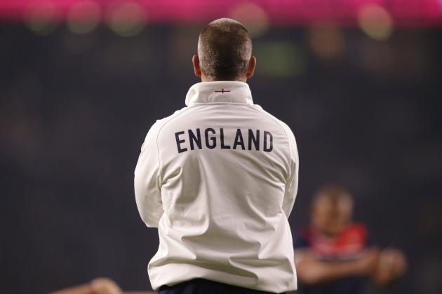 England’s coach Stuart Lancaster observes his players warm-up before the Rugby World Cup Pool A match between England and Australia at Twickenham stadium in London, Saturday, Oct. 3, 2015. (AP Photo/Matt Dunham)