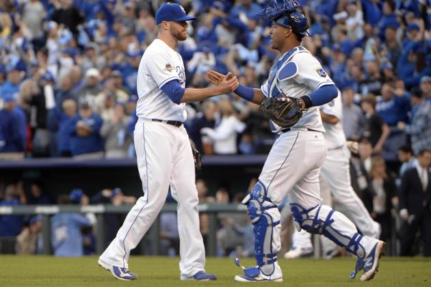 Oct 9, 2015; Kansas City, MO, USA; Kansas City Royals relief pitcher Wade Davis (left) celebrates with catcher Salvador Perez (right) after defeating the Houston Astros in game two of the ALDS at Kauffman Stadium. Mandatory Credit: John Rieger-USA TODAY Sports