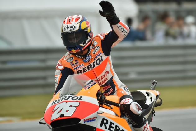 Repsol Honda Team rider Dani Pedrosa of Spain waves to the audience as he celebrates his win at the MotoGP Japanese Grand Prix in Motegi, Tochigi prefecture on October 11, 2015.     AFP PHOTO / KAZUHIRO NOGI        (Photo credit should read KAZUHIRO NOGI/AFP/Getty Images)