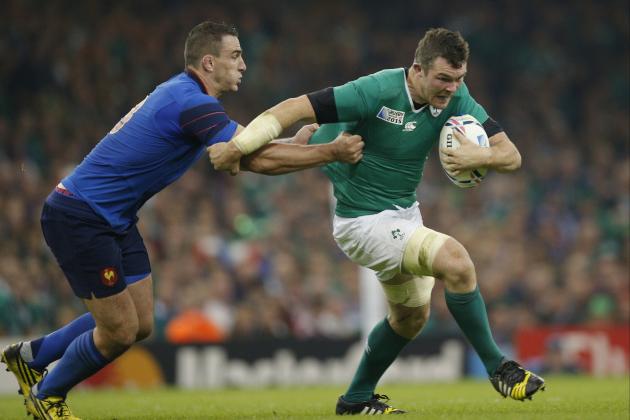 Ireland's Peter O'Mahony is tackled by France's Louis Picamoles during the Rugby World Cup Pool D match between France and Ireland at the Millennium Stadium, Cardiff, Sunday, Oct. 11, 2015. (AP Photo/Christophe Ena)