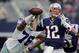 New England Patriots' Tom Brady (12) is pressured by Dallas Cowboys' Greg Hardy (76) during the first quarter of an NFL football game, Sunday, Oct. 11, 2015, in Arlington, Texas. (AP Photo/Tim Sharp)