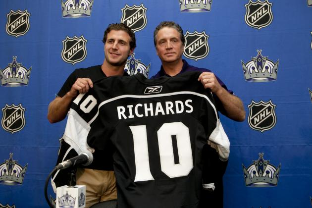 The Los Angeles Kings General manager, Dean Lombardi, right, introduces All-Star center, Mike Richards, Wednesday, July 27, 2011, at the Toyota Sports Center in El Segundo, Calif. Richards was acquired from the Philadelphia Flyers in exchange for Wayne Simmonds, Brayden Schenn and a 2012 second-round draft pick. (AP Photo/Damian Dovarganes)