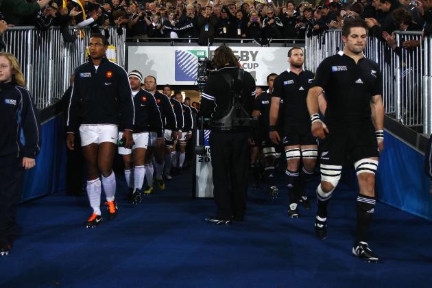 France's captain Thierry Dusautoir (L) and New Zealand All Blacks captain Richie McCaw (R) lead their teams ont the field during the 2011 Rugby World Cup final match New Zealand vs France at Eden Park Stadium in Auckland on October 23, 2011. AFP PHOTO / PHIL WALTER / POOL (Photo credit should read PHIL WALTER/AFP/Getty Images)