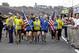 A group of the approximately 35 runners from the 2013 Boston Marathon, unable to finish the race due to the tragic bombings, complete the distance by crossing finish line at the Indianapolis Motor Speedway before the start of the 97th Indianapolis 500 auto race. (AP Photo/Michael Conroy)