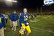 Michigan punter Blake O'Neill (12) walks off the field after an NCAA college football game against Michigan State in Ann Arbor, Mich., Saturday, Oct. 17, 2015. Michigan State's Jalen Watts-Jackson grabbed a flubbed punt by O'Neill and lumbered 38 yards into the end zone for a touchdown on the final play of the game, giving No. 7 Michigan State a shocking 27-23 win over No. 12 Michigan. (AP Photo/Tony Ding)