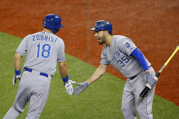 Kansas City Royals' Ben Zobrist, left, celebrates his two run home run with Eric Hosmer against the Toronto Blue Jays during the first inning in Game 4 of baseball's American League Championship Series on Tuesday, Oct. 20, 2015, in Toronto. (AP Photo/Paul Sancya)