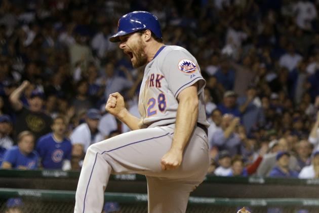 New York Mets' Daniel Murphy reacts after scoring during the seventh inning of Game 3 of the National League baseball championship series against the Chicago Cubs Tuesday, Oct. 20, 2015, in Chicago. Murphy scored from third on a ball hit by Lucas Duda. (AP Photo/David J. Phillip)