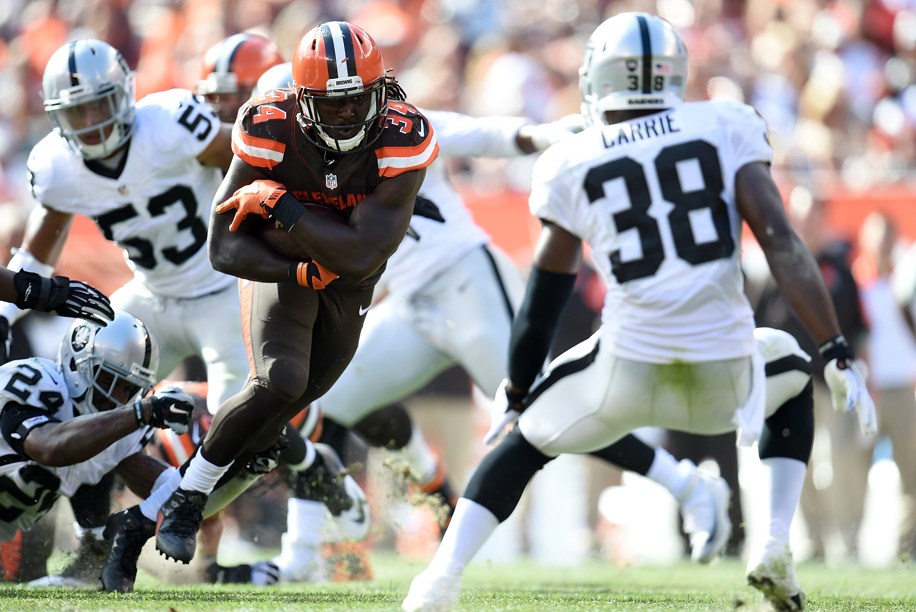 Oakland Raiders cornerback T.J. Carrie (38) breaks up a pass