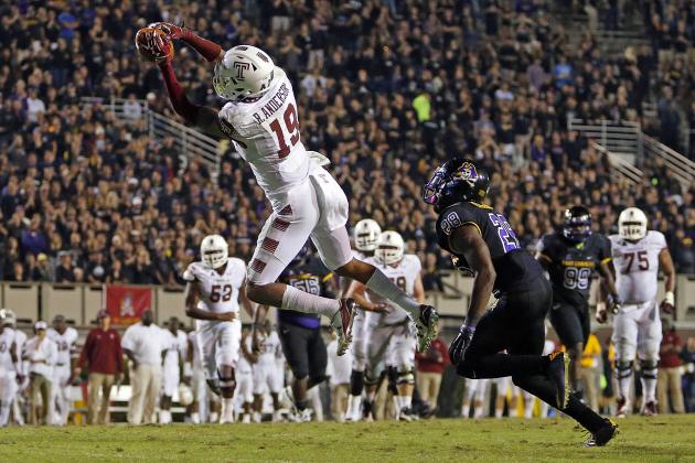 Temple's Robby Anderson (19) hauls in the go ahead  touchdown pass in front of East Carolina's Josh Hawkins (28) during the second half of an NCAA college football game in Greenville, N.C., Thursday, Oct. 22, 2015. Temple won 24-14. (AP Photo/Karl B DeBlaker)