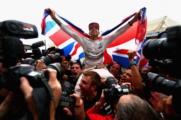 AUSTIN, TX - OCTOBER 25:  Lewis Hamilton of Great Britain and Mercedes GP celebrates with the team in the pit lane after winning the United States Formula One Grand Prix and the championship at Circuit of The Americas on October 25, 2015 in Austin, United States.  (Photo by Clive Mason/Getty Images)
