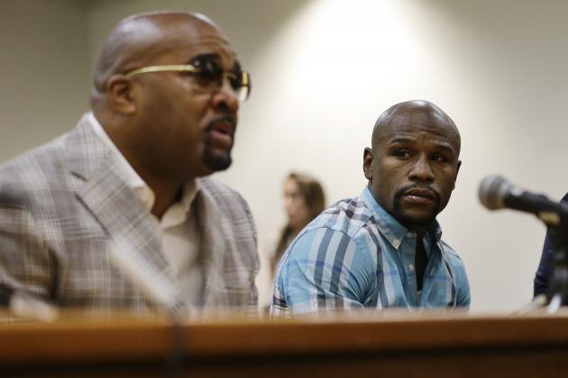 Boxer Floyd Mayweather Jr., right, appears with Leonard Ellerbe before the Nevada Athletic Commission Tuesday, Sept. 23, 2014, in Las Vegas. Mayweather Jr. appeared before the commission to answer questions about scenes aired on the reality show