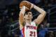 Detroit Pistons forward Ersan Ilyasova (23) shoots against the Brooklyn Nets in the second half of an NBA preseason basketball game in Auburn Hills, Mich., Thursday, Oct. 8, 2015. (AP Photo/Paul Sancya)