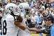 Oakland Raiders wide receiver Michael Crabtree, center, celebrates his touchdown with teammate wide receiver Andre Holmes, left, during the second half of an NFL football game against the San Diego Chargers, Sunday, Oct. 25, 2015, in San Diego. (AP Photo/Denis Poroy)