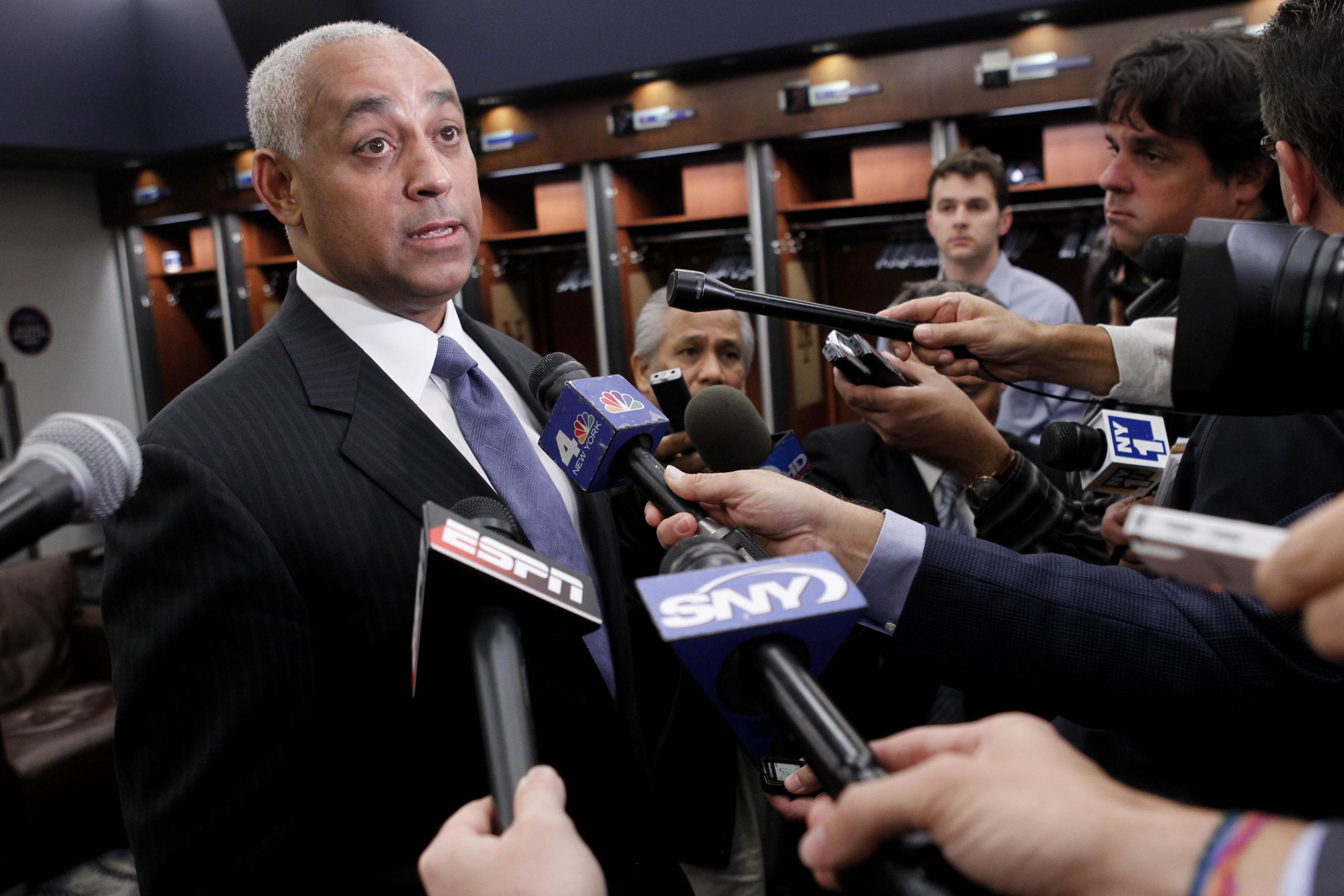 Omar Minaya, right, general manager of the Montreal Expos, announces the  return of the team to Puerto Rico at the San Juan Hotel & Casino in San  Juan, Wed., Dec. 17, 2003.