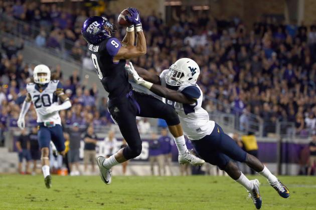 FORT WORTH, TX - OCTOBER 29:  Josh Doctson #9 of the TCU Horned Frogs pulls in a pass against KJ Dillon #9 of the West Virginia Mountaineers in the first quarter at Amon G. Carter Stadium on October 29, 2015 in Fort Worth, Texas.  (Photo by Tom Pennington/Getty Images)