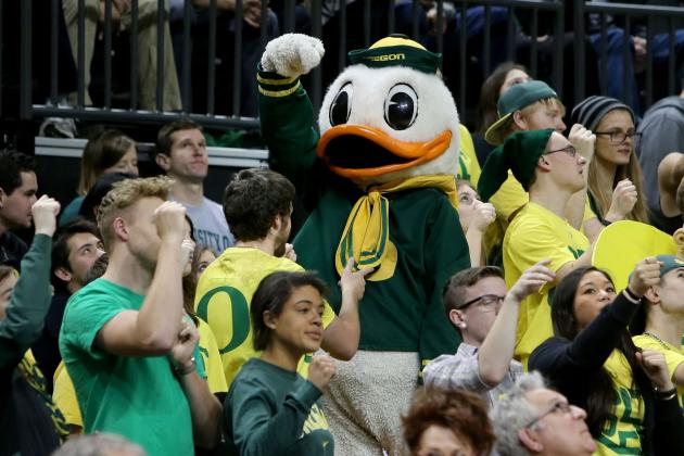 The Oregon Duck mascot clowns with the Oregon Pit Crew during the Civil War basketball an NCAA college basketball game against Oregon State in Eugene, Or. Saturday Jan. 3, 2015. (AP Photo/Chris Pietsch)