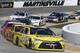 Matt Kenseth (20) leads the pack in Turn 4 during the NASCAR Sprint Cup Series auto race at Martinsville Speedway in Martinsville, Va., Sunday, March 29, 2015. (AP Photo/Steve Helber)
