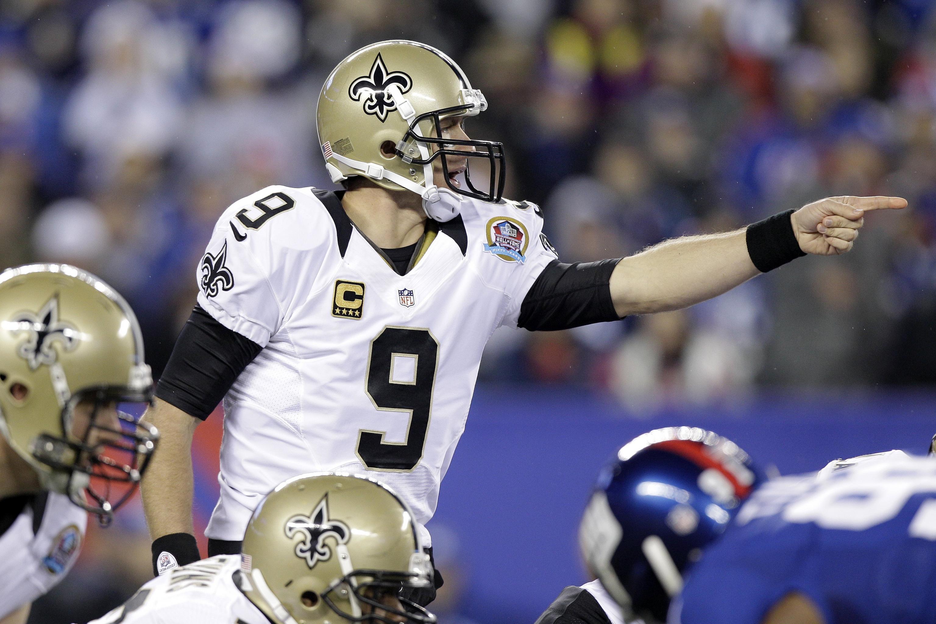 New Orleans Saints Drew Brees stretches on the sidelines before the game  against the New York Giants in week 4 of the NFL season at MetLife Stadium  in East Rutherford, New Jersey