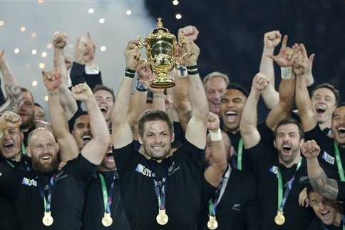New Zealand's captain Richie McCaw holds the trophy aloft after the Rugby World Cup final between New Zealand and Australia at Twickenham Stadium in London, Saturday, Oct. 31, 2015. The All Blacks won 34-17. (AP Photo/Christophe Ena)