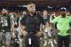 Hawaii coach Norm Chow stands with players and other team members after Air Force defeated Hawaii 58-7 in an NCAA college football game, Saturday, Oct. 31, 2015, in Honolulu. (AP Photo/Eugene Tanner)