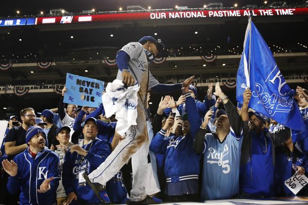 Kansas City Royals' Jarrod Dyson celebrates with fans after Game 5 of the Major League Baseball World Series against the New York Mets Monday, Nov. 2, 2015, in New York. The Royals won 7-2 to win the series. (AP Photo/Matt Slocum)