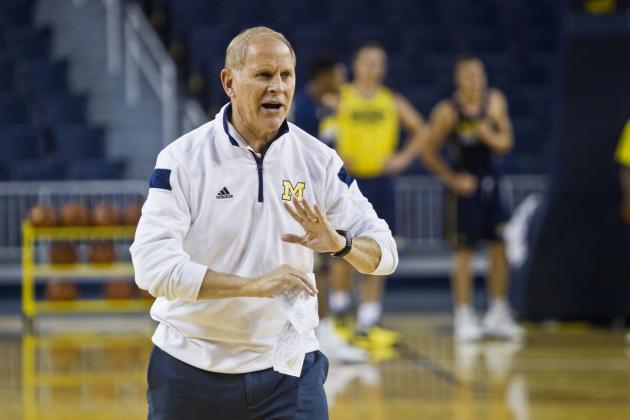 Michigan head coach John Beilein gives instructions to players on the court during a practice session at Crisler Center in Ann Arbor, Mich., Friday, Oct. 2, 2015. Today is the first day the NCAA college basketball team practiced together as a team for the season. (AP Photo/Tony Ding)
