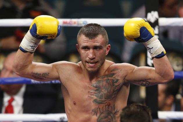 Vasyl Lomachenko, of the Ukraine celebrates his win against Gamalier Rodriguez, of Puerto Rico, after their featherweight title fight on Saturday, May 2, 2015 in Las Vegas. (AP Photo/Eric Jamison)